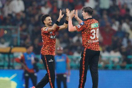 Harshal Patel and Pat Cummins