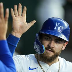 Kyle Isbel #28 of the Kansas City Royals is congratulated by teammates after scoring a run during the fifth inning against the Chicago White Sox at Kauffman Stadium on May 05, 2025 in Kansas City, Missouri.