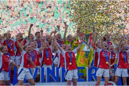 Arsenal players celebrate with their trophy after winning the women's Champions League final soccer match between Arsenal and FC Barcelona at the Jose Alvalade stadium in Lisbon, Saturday, May 24, 2025. (AP Photo/Armando Franca)