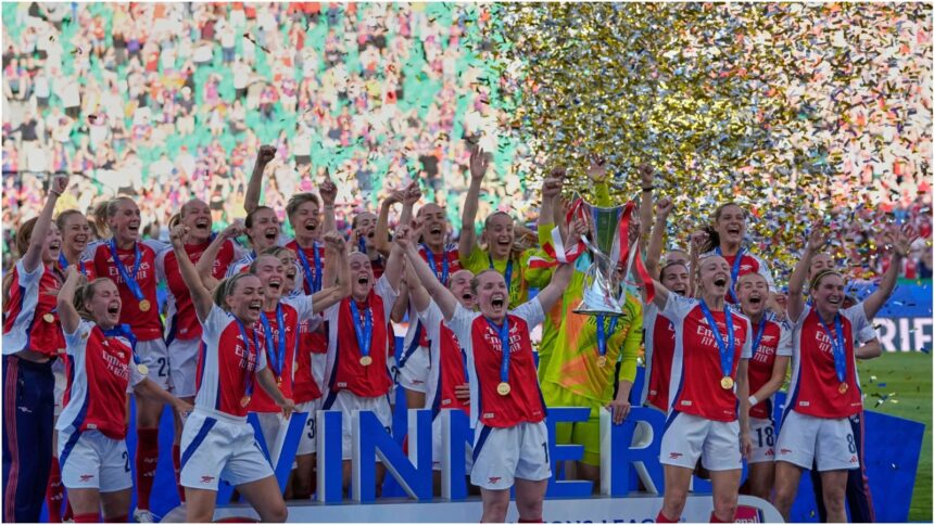 Arsenal players celebrate with their trophy after winning the women's Champions League final soccer match between Arsenal and FC Barcelona at the Jose Alvalade stadium in Lisbon, Saturday, May 24, 2025. (AP Photo/Armando Franca)