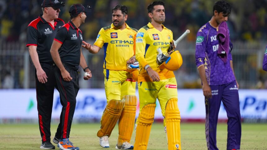 CSK captain Mahendra Singh Dhoni, center, and batting partner Anshul Kamboj leave the field at the end of the Indian Premier League cricket match between Kolkata Knight Riders and Chennai Super Kings at Eden Gardens in Kolkata, India, Wednesday, May 7, 2025. (AP Photo)