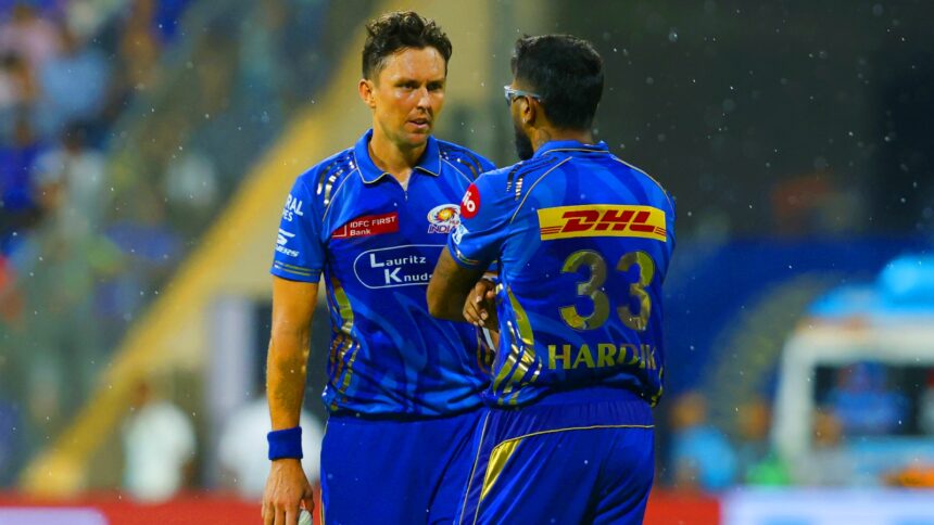 MI vs GT: Raindrops are seen as Trent Boult and Hardik Pandya of Mumbai Indians speak during an IPL 2025 match between Mumbai Indians and Gujarat Titans at the Wankhede Stadium. (Sportzpics for IPL)