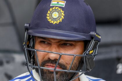 India's captain Rohit Sharma looks on as rain delays play during play on day three of the third cricket test between India and Australia at the Gabba in Brisbane, Australia, Monday, Dec. 16, 2024. (AP Photo)