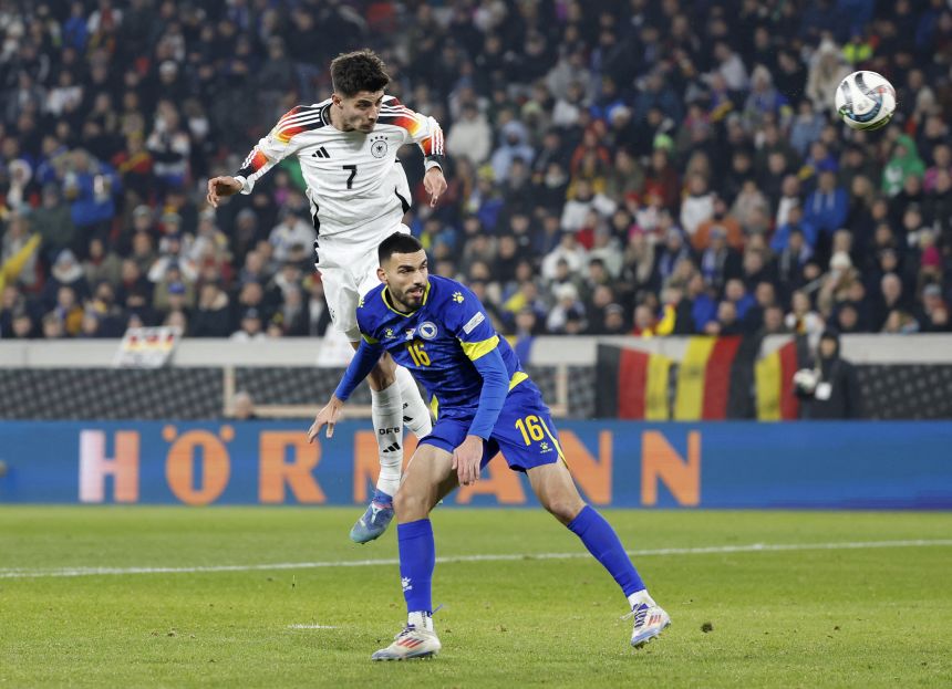 Germany's Kai Havertz, top, heads the ball during a Nations League match against Bosnia and Herzegovina.