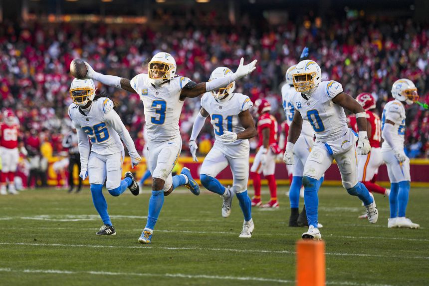Chargers safety Derwin James Jr. (3) celebrates with cornerback Donte Jackson (26) and linebacker Daiyan Henley (0) following the game-clinching interception.