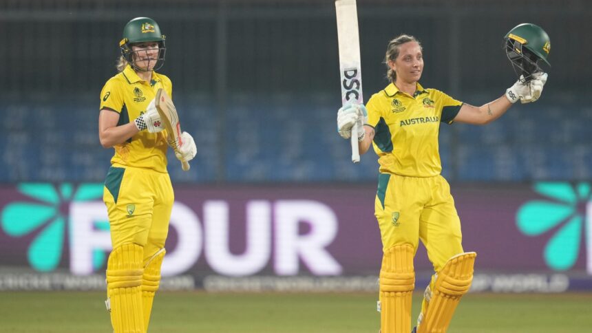 Australia's Ashleigh Gardner (R) celebrates her century with teammate Annabel Sutherland during the ICC Women's World Cup match against England. (PHOTO: AP)