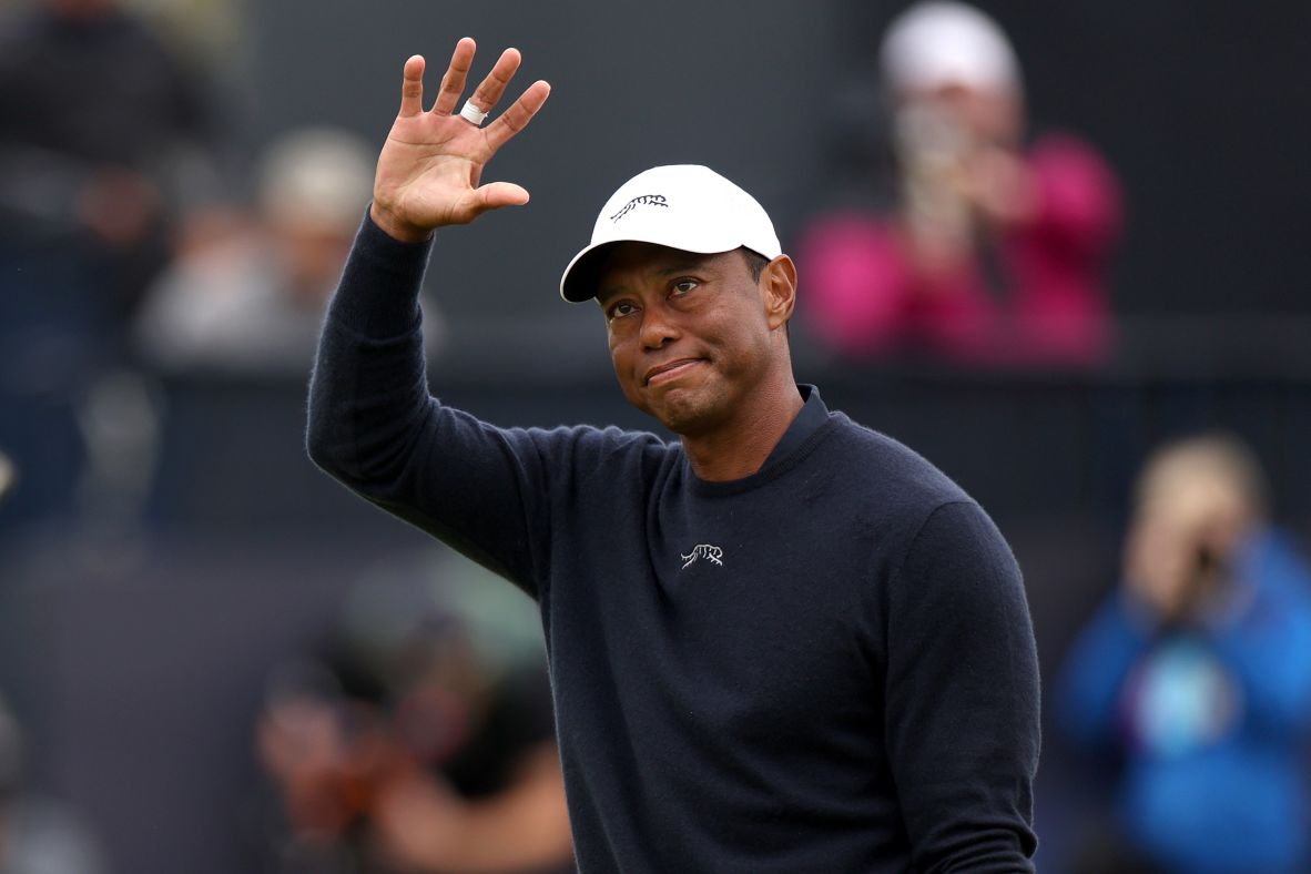 Woods acknowledges the crowd as he walks off the 18th green at the Open Championship in Troon, Scotland, in July 2024. <a href="https://www.cnn.com/2024/07/19/sport/tiger-woods-open-championship-cut-spt-intl">He had missed the cut for the third straight major.</a>