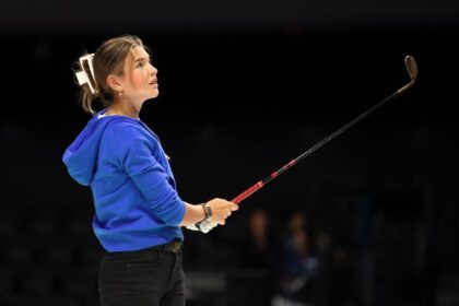 Kai Trump plays a shot before a TGL event in January.