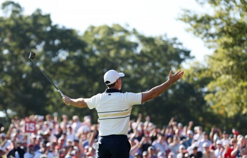 Rory McIlroy of Team Europe reacts to the crowd after making a birdie to halve the 15th hole during the Sunday singles matches of the 2025 Ryder Cup.