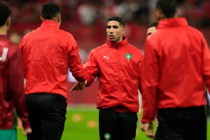 Achraf Hakimi shakes hands with teammates ahead of the African Cup of Nations Group A soccer match between Morocco and Mali in Rabat, Morocco, Friday, 26, 2025. (AP Photo)