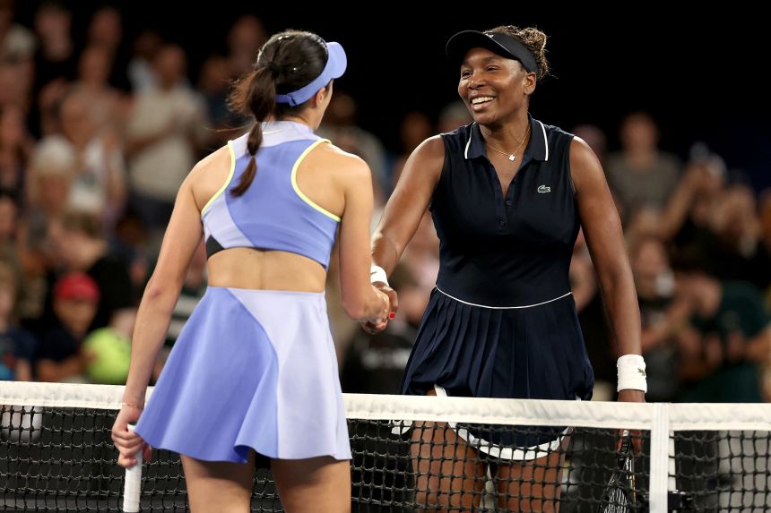 Serbia's Olga Danilovic shakes Venus Williams' hand after their women's singles match on day one of the Australian Open tennis tournament.
