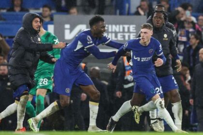 Cole Palmer and Chelsea team-mates celebrate after their stoppage-time winner against Manchester United