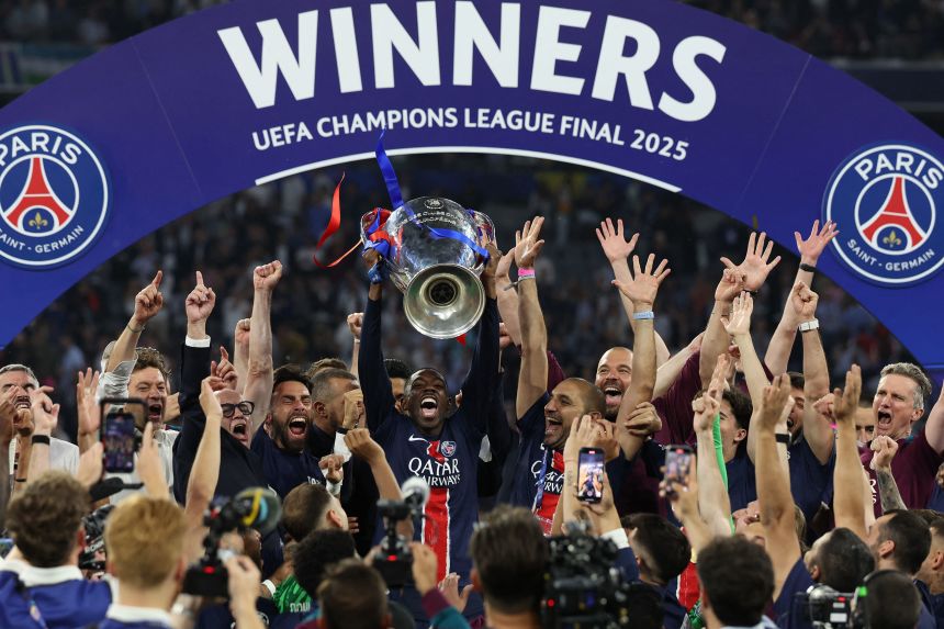 Dembélé lifting the Champions League trophy after PSG triumphed in record fashion last season.