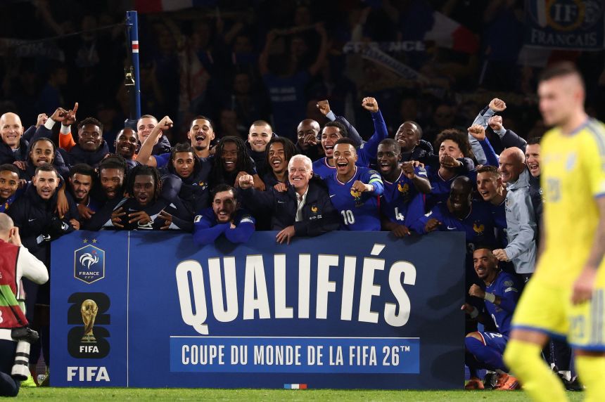 The France squad celebrating qualification for the 2026 World Cup in the US, Canada and Mexico.