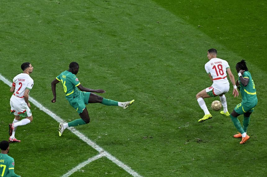 Senegal midfielder Pape Gueye shooting his rocket-like effort which ultimately decided the match.