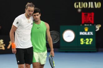Carlos Alcaraz, right, embraces Alexander Zverev after his victory at Melbourne Park on Friday.