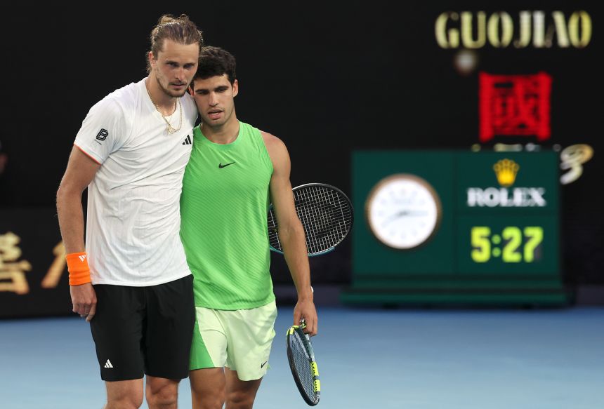 Carlos Alcaraz, right, embraces Alexander Zverev after his victory at Melbourne Park on Friday.