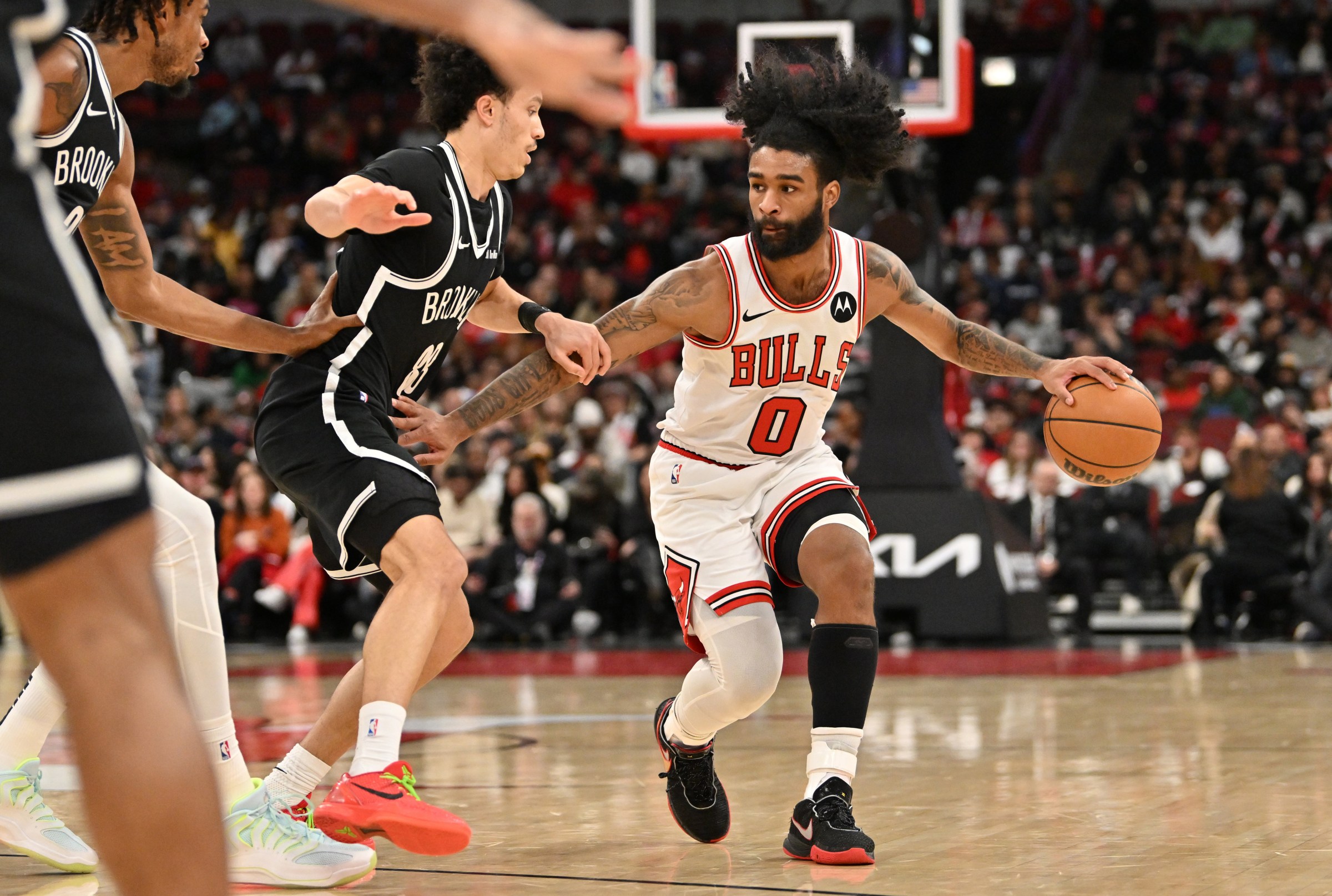 imagn-28037533 Jan 18, 2026; Chicago, Illinois, USA; Chicago Bulls guard Coby White (0) dribbles against the Brooklyn Nets during the first half at United Center. Mandatory Credit: Patrick Gorski-Imagn Images