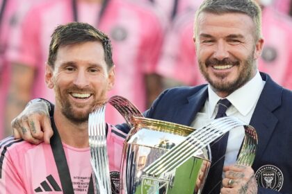 David Beckham poses with the MLS Cup trophy with Inter Miami forward Lionel Messi Saturday, Dec. 6, 2025, in Fort Lauderdale, Fla. (AP Photo)