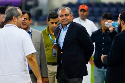 Pakistan's Minister of Interior and President of the Asian Cricket Council Mohsin Naqvi, center, stands with officials on the field after India won the Asia Cup cricket final against Pakistan at Dubai International Cricket Stadium, United Arab Emirates, Sunday, Sept. 28, 2025. (AP Photo)