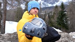Vladyslav Heraskevych of Ukraine shows his helmet following his disqualification for wearing it in tribute to athletes who have died amid Russia's attack on Ukraine, at Cortina Sliding Centre in Cortina d'Ampezzo, Italy on February 12, 2026.