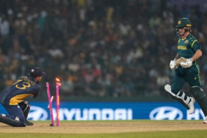 Sri Lanka's Kusal Mendis, left, shatters the stumps to get Australia's Adam Zampa run out during the T20 World Cup cricket match between Sri Lanka and Australia in Pallekele, Sri Lanka. (AP Photo)