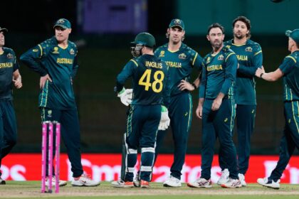 Australia's Glenn Maxwell, centre, celebrates with teammates the wicket of Oman's Jiten Ramanandi during the T20 World Cup cricket match between Australia and Oman in Pallekele, Sri Lanka. (AP Photo)