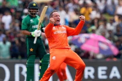 Netherlands' Roelof van der Merwe celebrates the wicket of Pakistan's Babar Azam, behind, during the T20 World Cup cricket match between Netherlands and Pakistan in Colombo, Sri Lanka, Saturday, Feb. 7, 2026. (AP Photo)