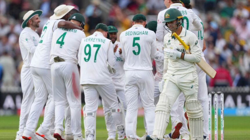South Africa players celebrate as Australia's Alex Carey, right, walks off the field after losing his wicket on day two of the World Test Championship final between South Africa and Australia at Lord's cricket ground in London, Thursday, June 12, 2025. (AP Photo/Kirsty Wigglesworth)