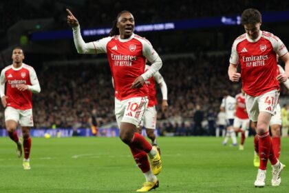 Arsenal's Eberechi Eze celebrates scoring his side's third goal during the English Premier League soccer match between Tottenham Hotspur and Arsenal in London. (AP Photo)