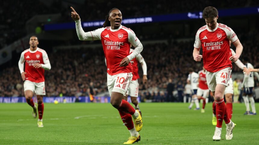 Arsenal's Eberechi Eze celebrates scoring his side's third goal during the English Premier League soccer match between Tottenham Hotspur and Arsenal in London. (AP Photo)