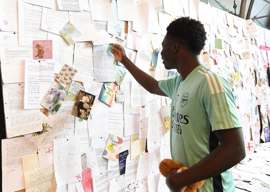 Arsenal's Bukayo Saka reads letters of support sent to the club from football fans at London Colney on August 04, 2021 in St Albans, England.