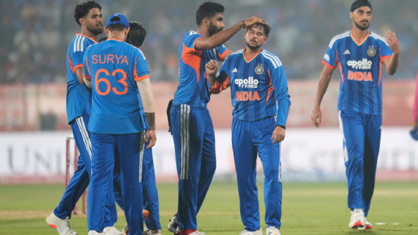 India's Kuldeep Yadav celebrates the dismissal of New Zealand's Glenn Phillips with teammates during the fourth T20 cricket match between India and New Zealand in Visakhapatnam on Wednesday. (AP Photo)