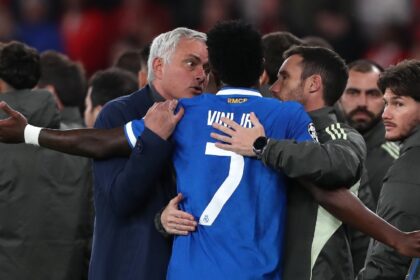 Real Madrid's Vinicius Junior argues with Benfica's head coach José Mourinho after scoring the opening goal during a Champions League playoff soccer match between SL Benfica and Real Madrid in Lisbon. (AP Photo)