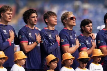 Namibia team stand for their national anthem during the T20 World Cup cricket match between Namibia and Netherlands in New Delhi, India, Tuesday, Feb. 10, 2026. (AP Photo)
