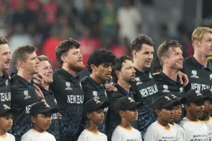 The New Zealand players couldn't help but crack up as their national anthem was played. (AP Photo)