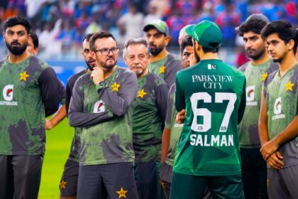 Pakistan cricket team coach Mike Hesson waits with the Pakistan team for the presentation ceremony after the Asia Cup final. (PHOTO: AP)