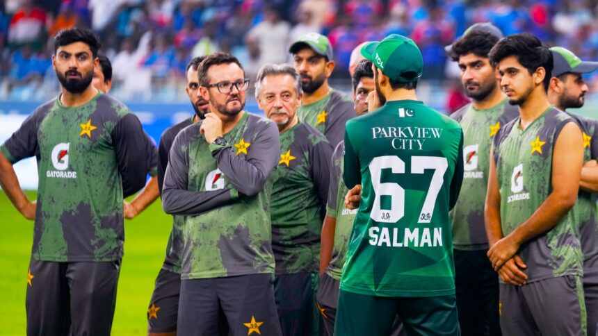 Pakistan cricket team coach Mike Hesson waits with the Pakistan team for the presentation ceremony after the Asia Cup final. (PHOTO: AP)