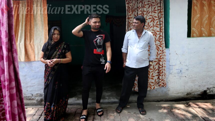 Rinku Singh with his mother and father at his residence in Aligarh. (Express Photo by Gajendra Yadav)