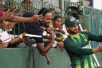 Pakistan's Sahibzada Farhan takes picture with his supporters before the start of the T20 World Cup match between Pakistan and US in Colombo, Sri Lanka, Tuesday, Feb. 10, 2026. (AP Photo)