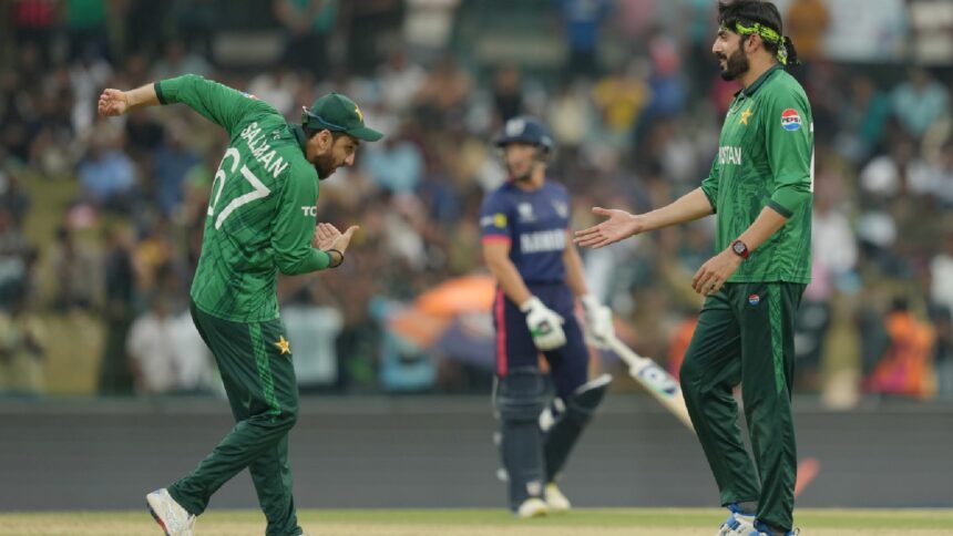 Pakistan's Usman Tariq, right celebrates with captain Salman Ali Agha, left, after a wicket against Namibia during the T20 World Cup. (AP Photo)