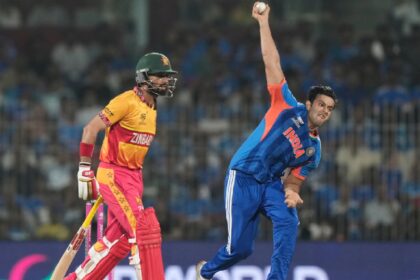 India's Shivam Dube, right, bowls a delivery during the T20 World Cup cricket match between India and Zimbabwe in Chennai, India, Thursday, Feb. 26, 2026. (AP Photo)