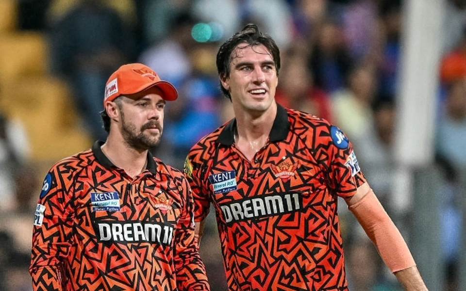 Pat Cummins with Travis Head