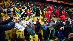 Senegal fan clashes with security as fans invade the pitch after Morocco was awarded a penalty following a VAR review in Rabat, Morocco, on January 18.