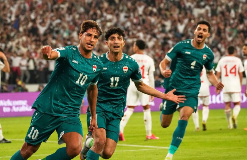 Iraq's Mohanad Ali, left, celebrates with teammates after scoring in a playoff match against the United Arab Emirates in November.