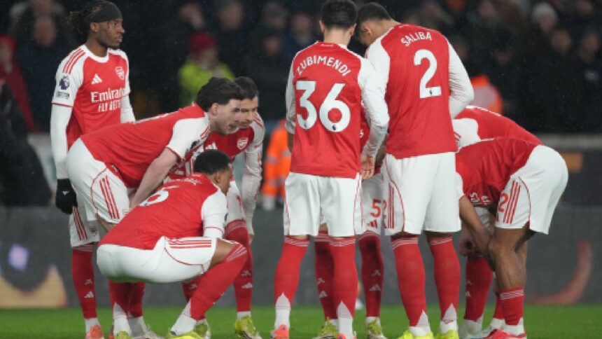 Arsenal team players talk before the Premier League soccer match between Wolverhampton Wanderers and Arsenal in Wolverhampton. (AP Photo)