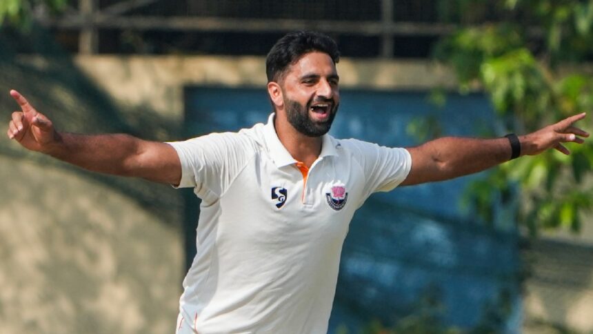 Jammu and Kashmir's Auqib Nabi celebrates during the third day of the Ranji Trophy semifinal match between Bengal and Jammu and Kashmir at the Bengal Cricket Academy Ground, in Kalyani, West Bengal. (PTI Photo)