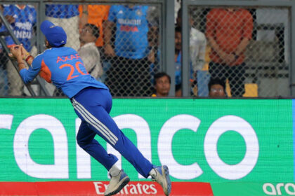 India's Axar Patel catches the ball in the T20 World Cup semi-final against England at Mumbai's Wankhede Stadium. (Express photo Narendra Vaskar)