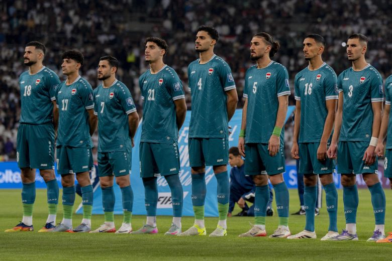 Iraqi players stand together before a World Cup playoff match against the United Arab Emirates in November.