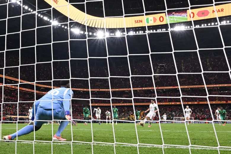 Morocco's Brahim Diaz takes his penalty, which was saved by Senegal goalkeeper Édouard Mendy.